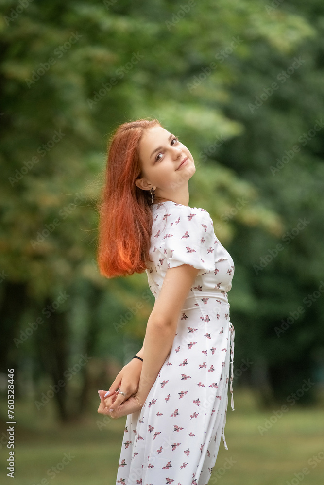 Portrait of a young beautiful red-haired girl outdoors. Portrait of a young beautiful red-haired girl outdoors.