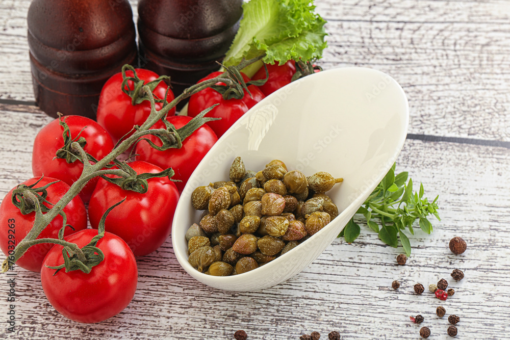 Marinated green capers in the bowl Marinated green capers in the bowl