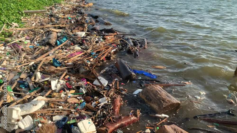 Heap of plastic waste floating on the beach, environmental issue damage. Water pollution problem. Heap of plastic waste floating on the beach, environmental issue damage. Water pollution problem.