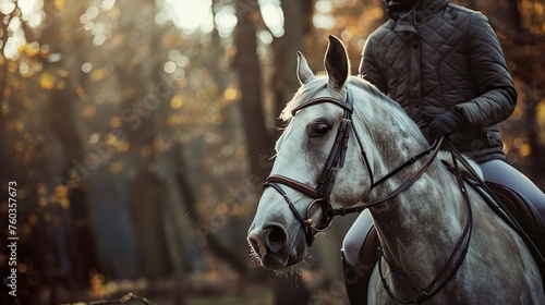 A horse ridden by its master © Photock Agency