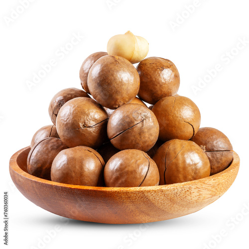 Pile of Macadamia nuts in a wooden bowl isolated on white background
