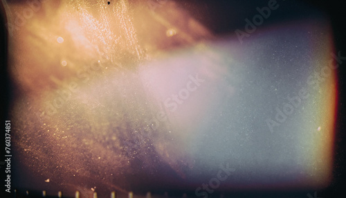 Abstract film texture background with grain, dust and light leaks; artistic image of the camera photo
