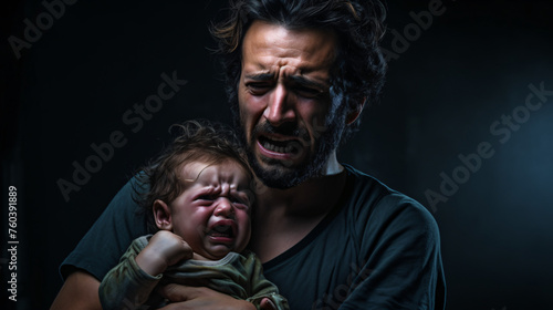 Portrait of a man and a baby crying together in pain, crying and holding an injured baby, father's affection to a child concept © Chamli_Pr