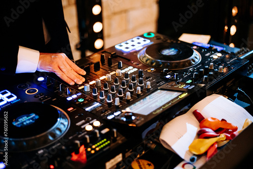 Dj at work party colors playing music wedding disco console enterteinment mixer buttons dancing dance floor 