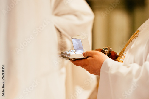 Wedding rings in a church during catholic ceremony