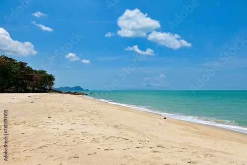 Fototapeta Naklejka Na Ścianę i Meble -  Beautiful wave on the beach, clear water, white sand in your holiday at Khanom beach Nakhon si thammarat Thailand. .Golden sand, white waves and beautiful sea. Good for relaxing