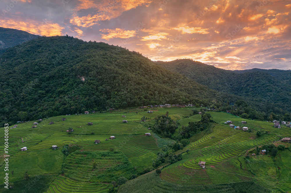 Fototapeta premium Aerial views of Small house and rice terraces field at pabongpaing village rice terraces Mae-Jam Chiang mai, Thailand. The view point for travel. Rice Field Terrace