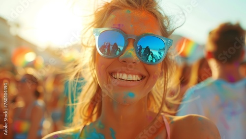 Portrait of happy young woman at holi color festival on beach