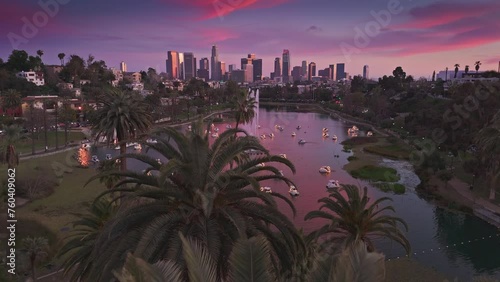 Aerial view of Echo Park Lake and downtown Los Angeles skyline at sunset. 4K UHD.