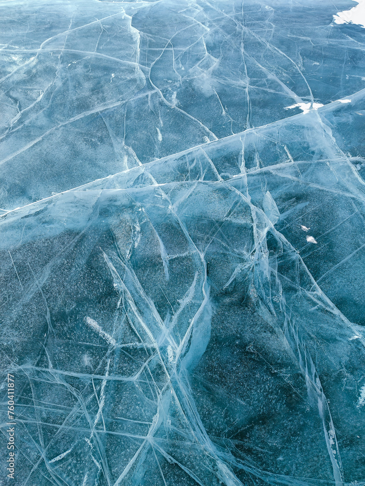 Abstract natural ice texture. Freezy ice surface. Blue backdrop with cracks and scratches on frozen water. Abstract natural ice texture. Freezy ice surface. Blue backdrop with cracks and scratches on frozen water.