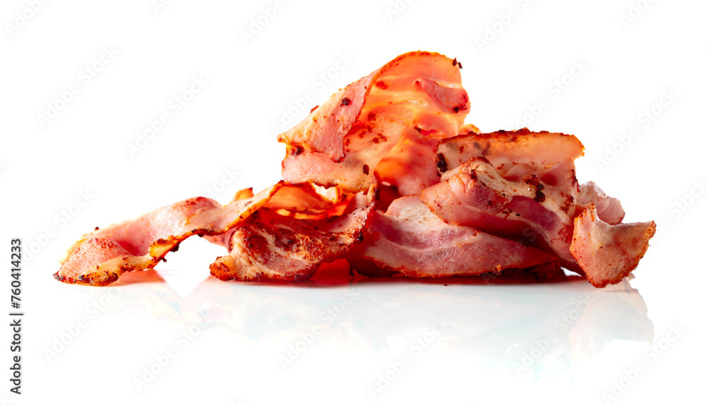 Fried bacon slices isolated on white.