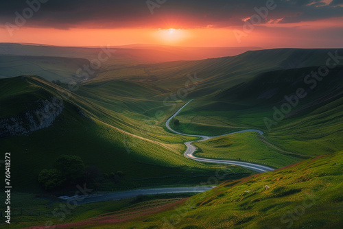 beautiful road among the green hills with amazing sunset view