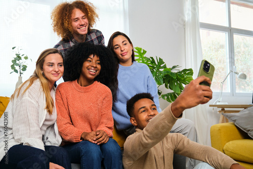 Group of multiethnic happy friends taking a selfie at home. Smiling people portrait.