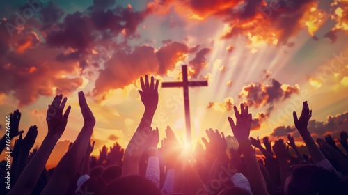 hands raised up to a cross with sunset background, in the style of religious, photorealistic rendering © Dara