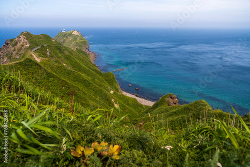 Scenic coastal trails winds along the dramatic cliffs of Hokkaid photo