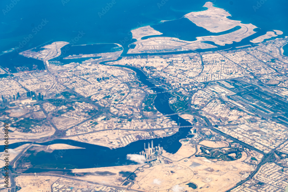 Aerial view of urban development near a coastline with waterways