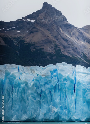 Majestic Glacier Front Against Rugged Mountain Peaks
