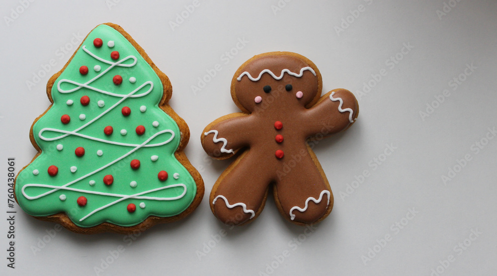 Holidays Background With Gingerbread Man And Pine Tree Cookies With Decorative Icing Isolated On White

