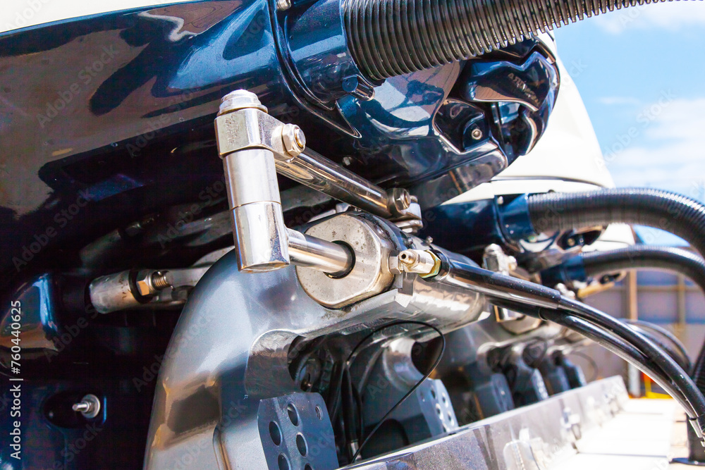 Lifting mechanisms on outboard motors at the stern of the boat. Transom lift on outboard motors