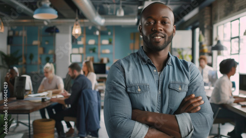 Businessman with a positive attitude standing confidently in an office.