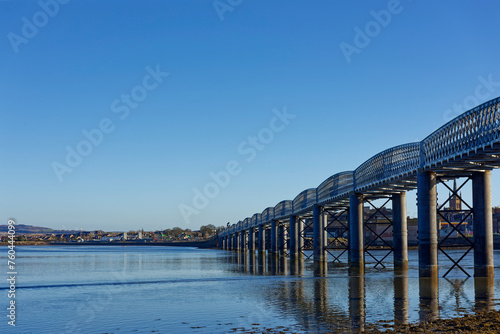 The South Esk Viaduct, a wrought Iron single track Rail Bridge crossing the Tidal Basin at Montrose with the tide going out. photo