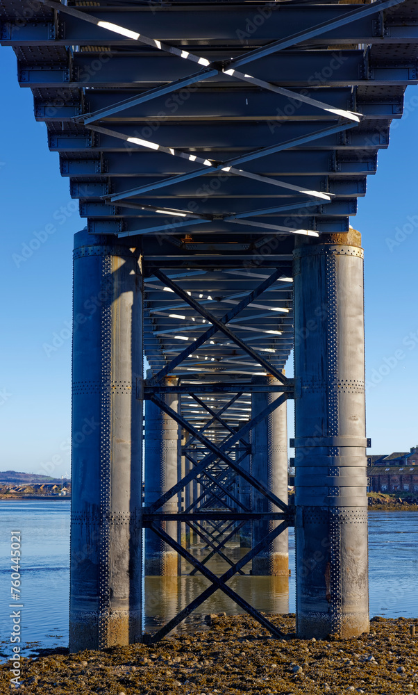 Looking through the Cross braced Cylindrical Piers filled with concrete of the South Esk Rail Bridge at the coastal town of Montrose.