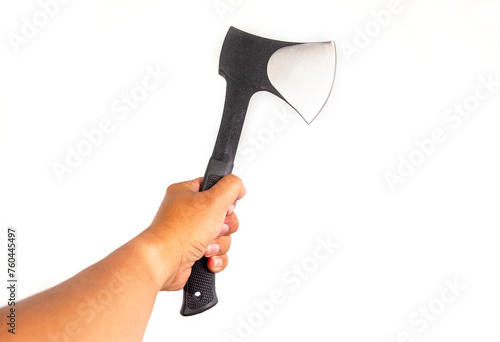 A hand holds an iron axe with a rubber handle for cutting wood on an isolated white background