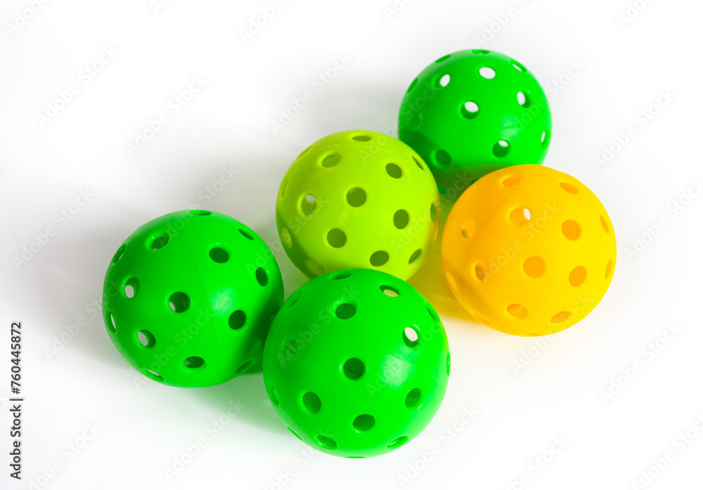 Multi colors pickleball balls isolated on a white background Multi colors pickleball balls isolated on a white background