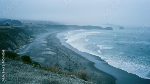 analogue still high angle shot of a foggy beach landscape