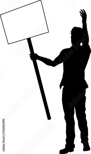 Protestor or demonstrator at a demonstration march, picket line or strike protest rally in silhouette. Holding up a banner or picket sign board placard.