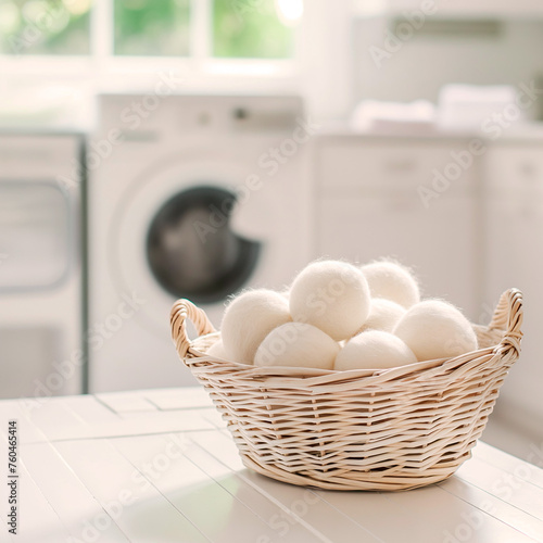 Basket of wool dryer balls on kitchen counter with laundry room background. Concept of this image could be used for sustainable home goods promotion and natural lifestyle marketing.