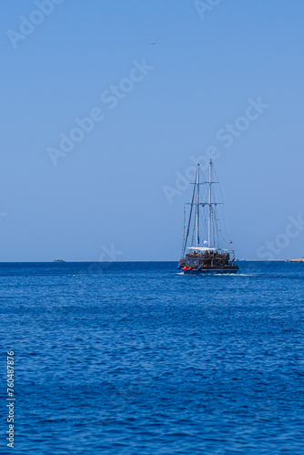 Sailing lboat at open sea in sunshine