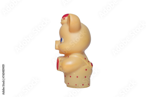 piglet with big blue eyes toy  in little hat and red polka dots jumpsuit playing at accordion. from side. on white background