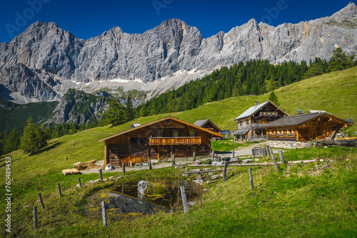 Wooden houses on the slope in the Alps, Austria