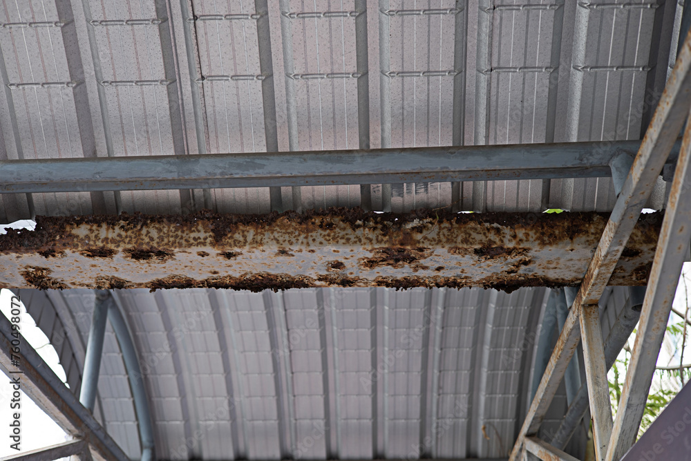 The steel roof structure is rusted and corroded due to a long time ...