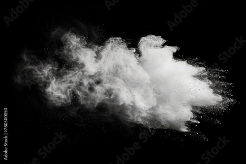 A swirling cloud of smoke captured in monochrome colors, billowing and dispersing in the air