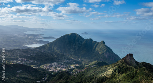 Overlooks two peaks in northeast Taiwan, teapot mountain and Keelung mountain, and Keelung island also in the distances of ocean, sunlight shines on the village, in Jiufen, Jinguashi, New Taipei