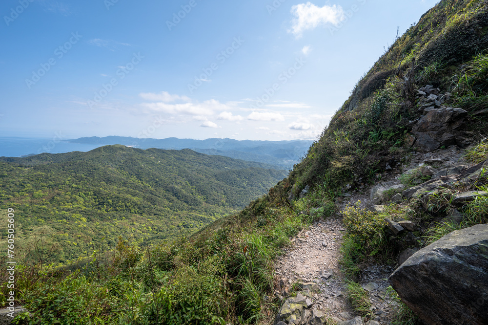 Shooting from half way of mountain trail, green mountain and blue ocean into the eyes, in Jiufen, Jinguashi, New Taipei City, Taiwan.