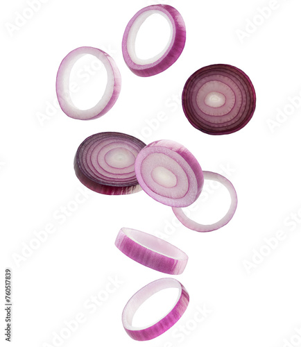 Red onion rings and slices fall in space. Volumetric light from behind. Isolated on white
