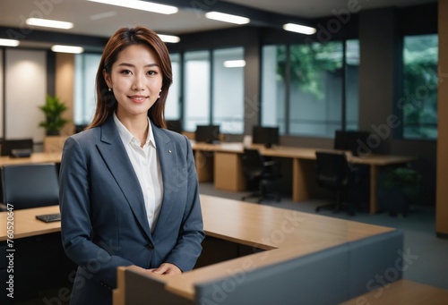 Exuding Confidence: happy Japanese Businesswoman posing confitently in Modern Office
