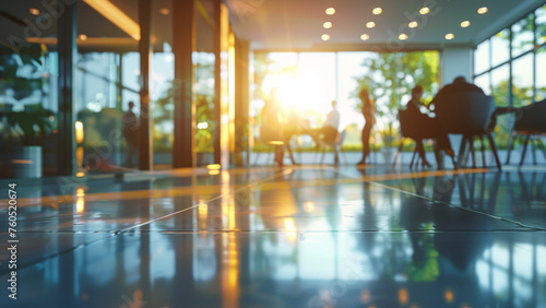 Contemporary corporate setting: glass office space with casually dressed people, featuring blurred bokeh background for modern business ambiance
