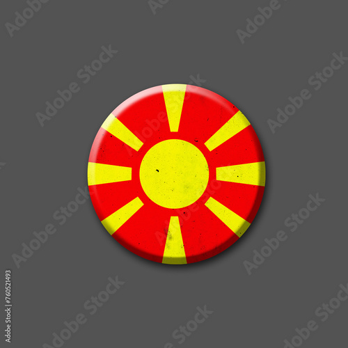 Metal Round badge in the colors of the North Macedonia flag. Isolated on grey background. Design element. 3D illustration. Signs and symbols