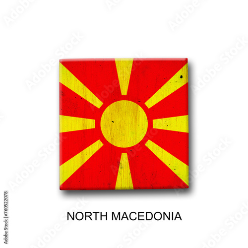 North Macedonia flag on a wooden block. Isolated on white background. Signs and symbols.