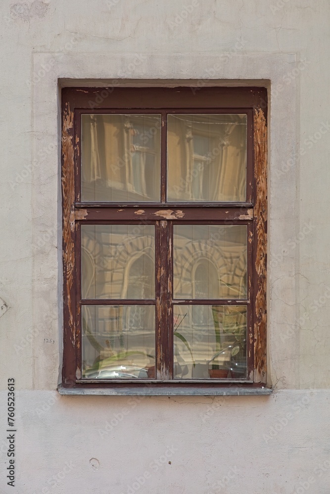 Closeup of old weatherd brown wood frame window on stone building. Closeup of old weatherd brown wood frame window on stone building.
