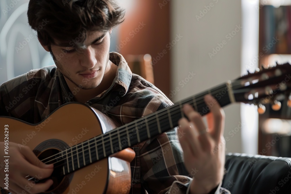 Obraz premium Young Hispanic Musician Playing Classical Guitar in Studio