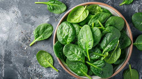 Fresh spinach leaves on white plate. Healthy vegan food  Top view   reated with Generative Ai