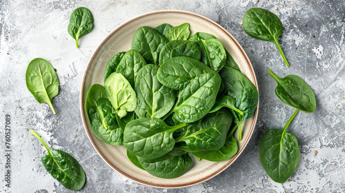 Fresh spinach leaves on white plate. Healthy vegan food, Top view сreated with Generative Ai