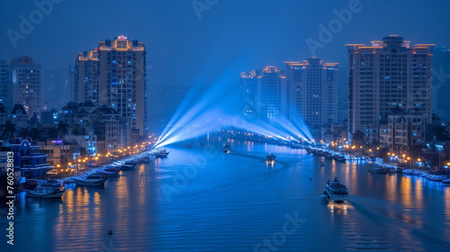 Illuminated Cityscape with Spotlight Beams over River