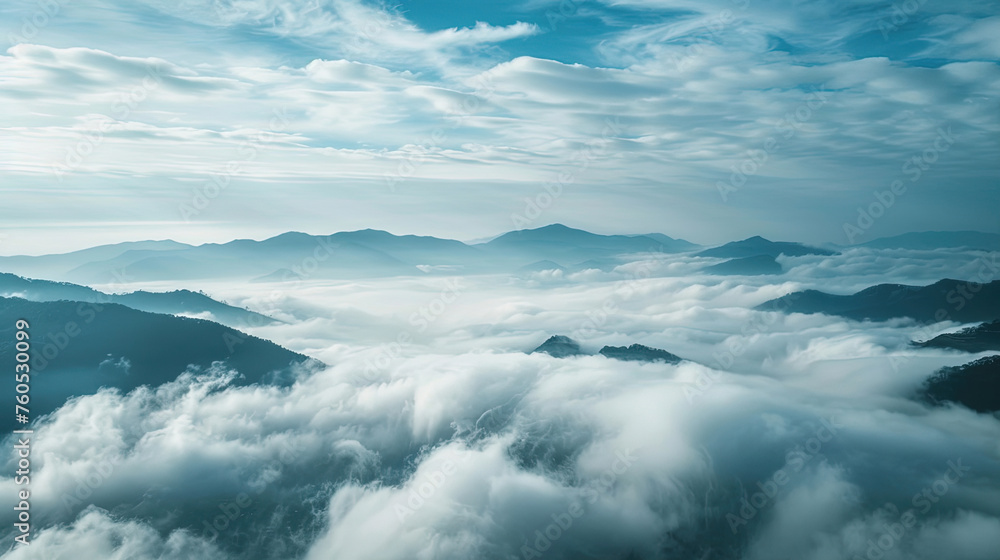 Above clouds view of mountain ranges