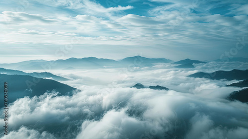 Above clouds view of mountain ranges